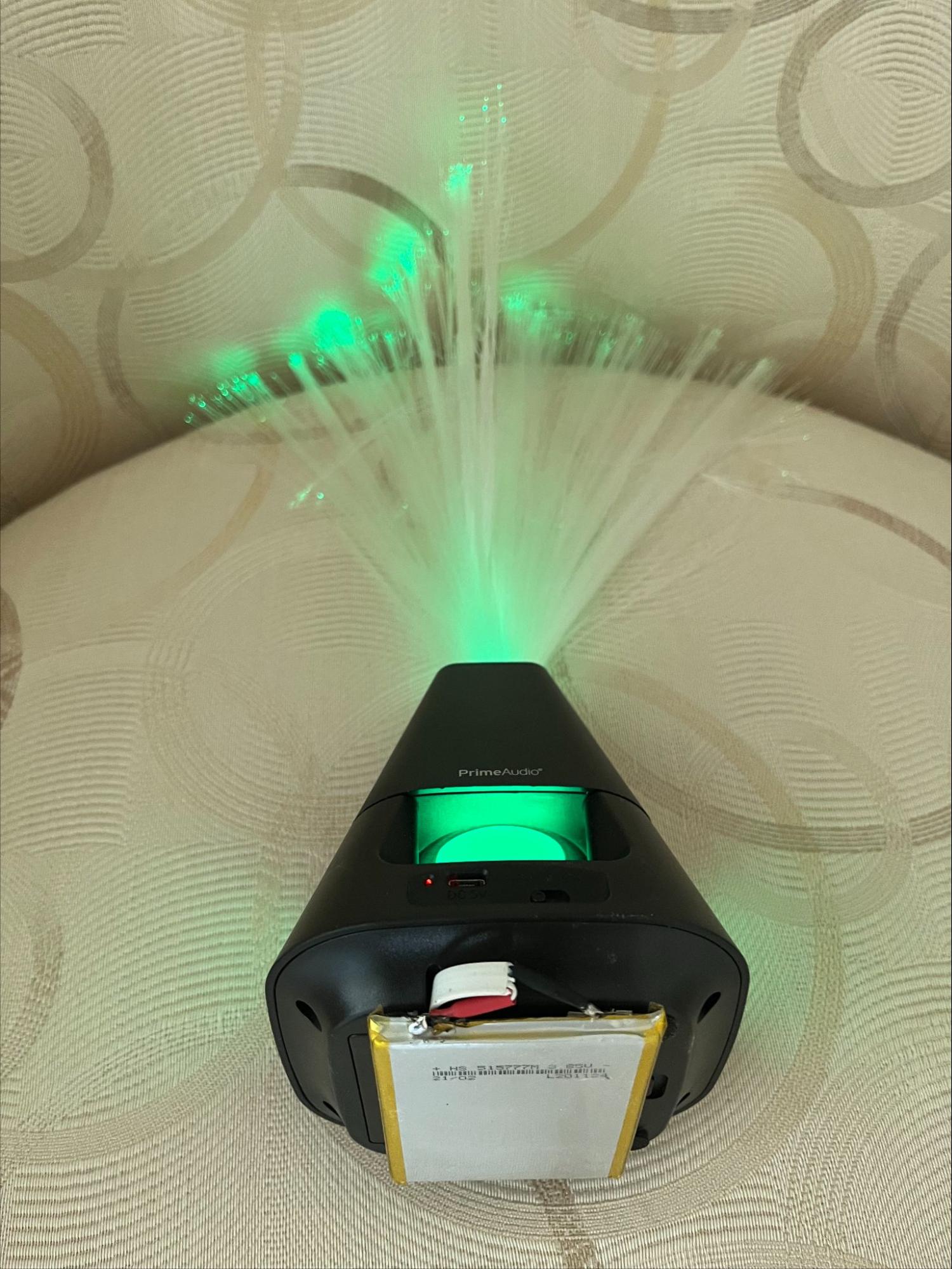 Fiber optic flower/speaker powered by recharged cell from dead laptop battery pack